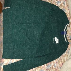 A green sweatshirt from Nike.